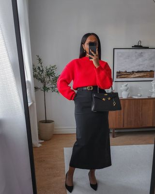 @femmeblk wearing a red jumper and black column skirt