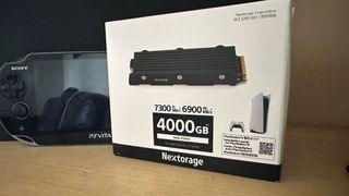 Nextorage NEM-PA Series PS5 SSD's packaging stood next to other PlayStation gear