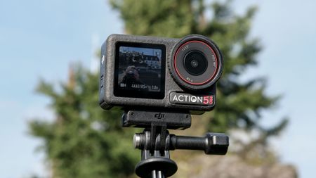 The DJI Osmo Action 5 Pro against an outdoors background