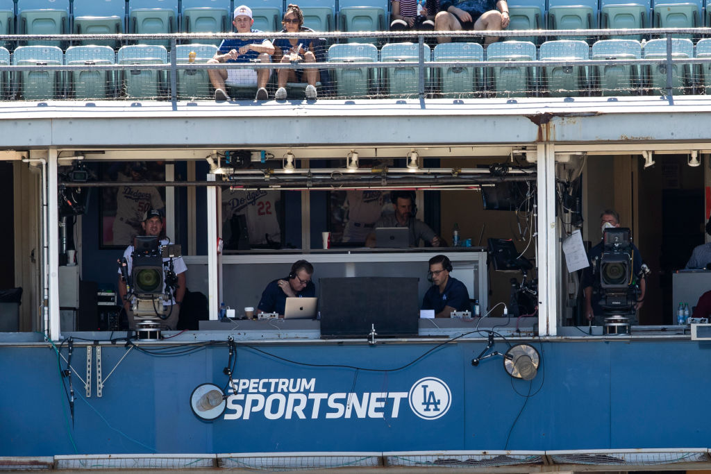 LOS ANGELES, CA - SEPTEMBER 20: Broadcasters Orel Hershiser, left, and Joe Davis sit in the Spectrum SportsNet booth during game 1 of a doubleheader between the Arizona Diamondbacks and Los Angeles Dodgers on September 20, 2022, at Dodger Stadium in Los Angeles, CA. (Photo by Brandon Sloter/Icon Sportswire via Getty Images)