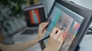 Woman's hands using Wacom tablet for animating: best tablet for animation
