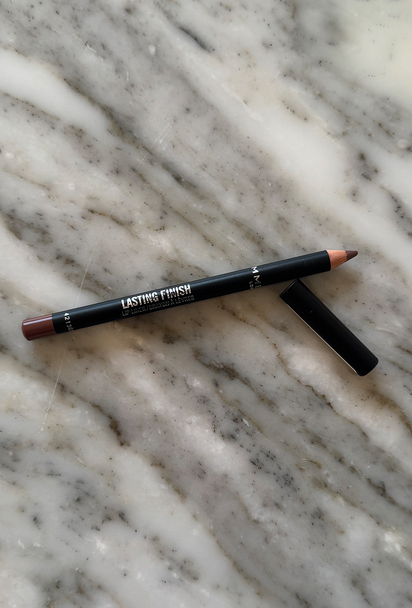 Rimmel Cappuccino lip liner on marble surface