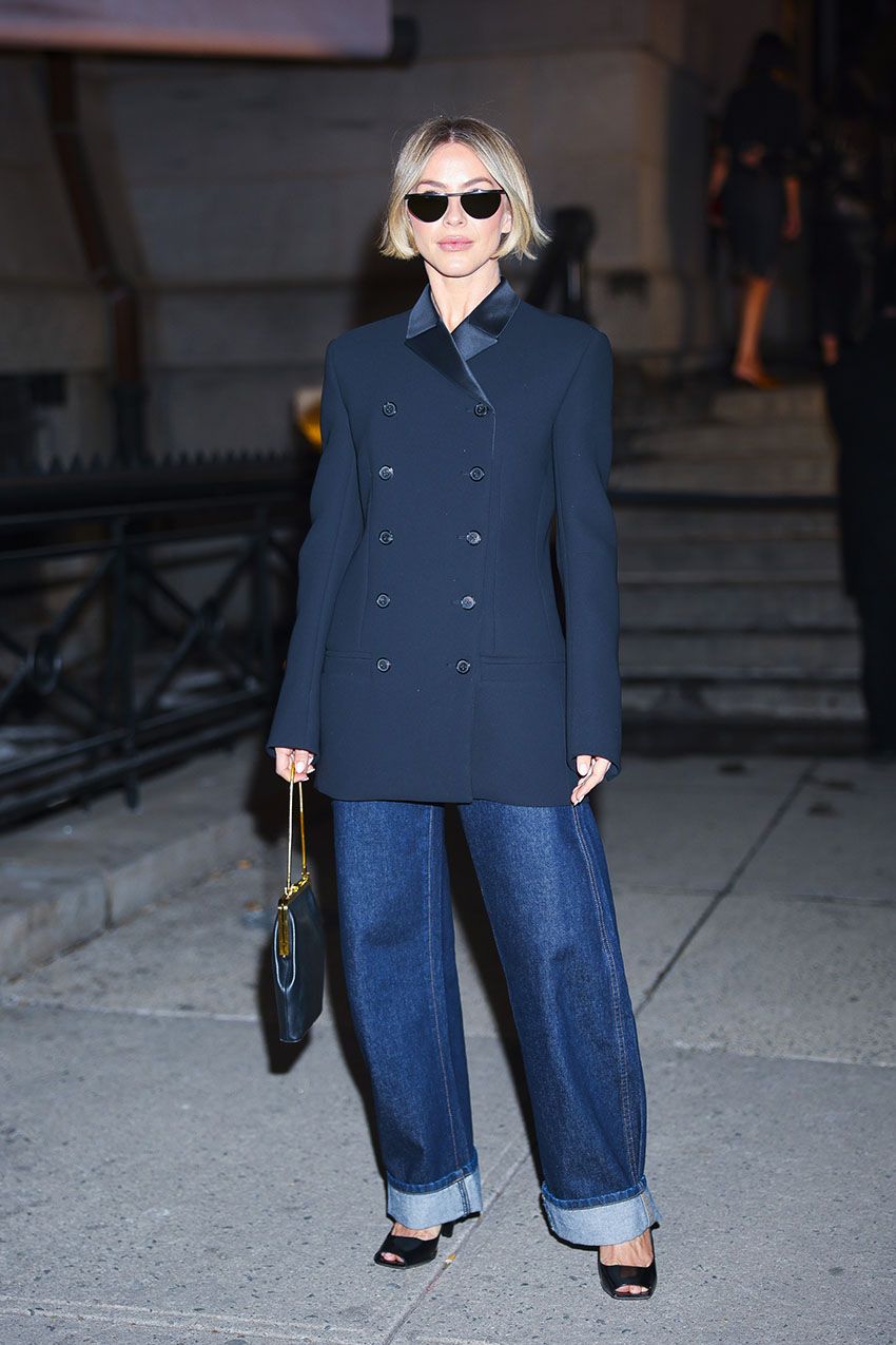 Julianne Hough wearing a navy blazer, blue jeans, and heels