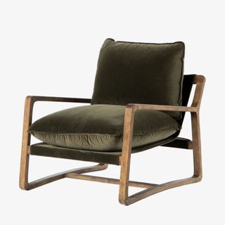 dark green velvet armchair with wooden frame