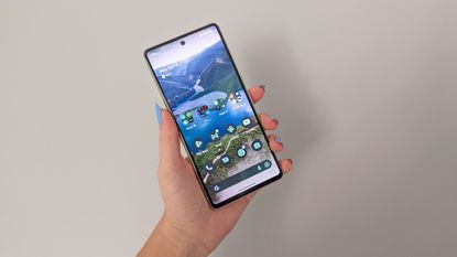 Google Pixel 7 review: phone screen open in front of wall