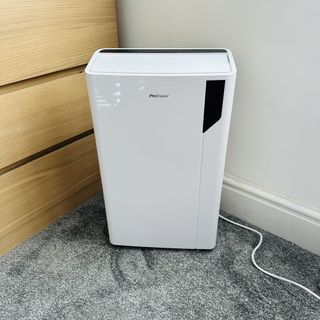 The Pro Breeze 20L Premium Dehumidifier with Special Laundry Mode being tested in a carpeted room