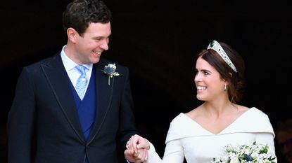 Jack Brooksbank and Princess Eugenie leave St George's Chapel after their wedding ceremony on October 12, 2018 in Windsor, England.