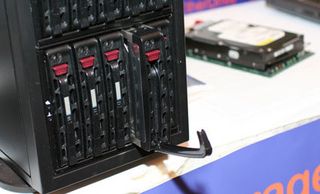 Drives are hot-swappable and the RAID information is contained within the drive. Company reps told us that the drives can be jumbled around and still maintain their RAID configuration.