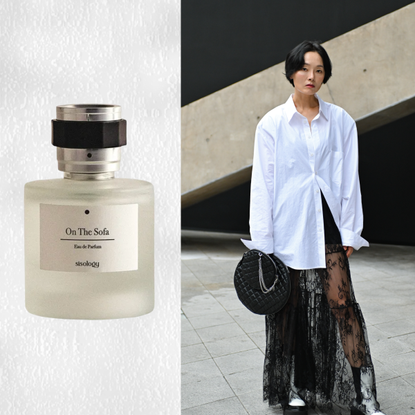 A woman wearing a white button up, lace skirt, and white boots. She is next to a bottle of perfume from a Korean brand.