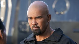Shemar Moore looking seriously at another person in a press image from S.W.A.T.