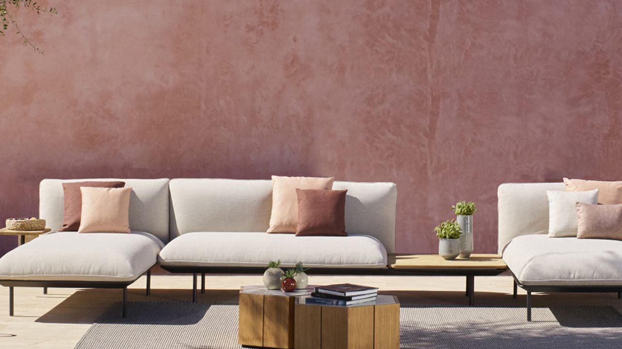 modern outdoor sofa and pink wall