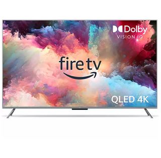 The silver 65-inch Amazon Fire TV Omni QLED on a white background with colourful smoke on the screen