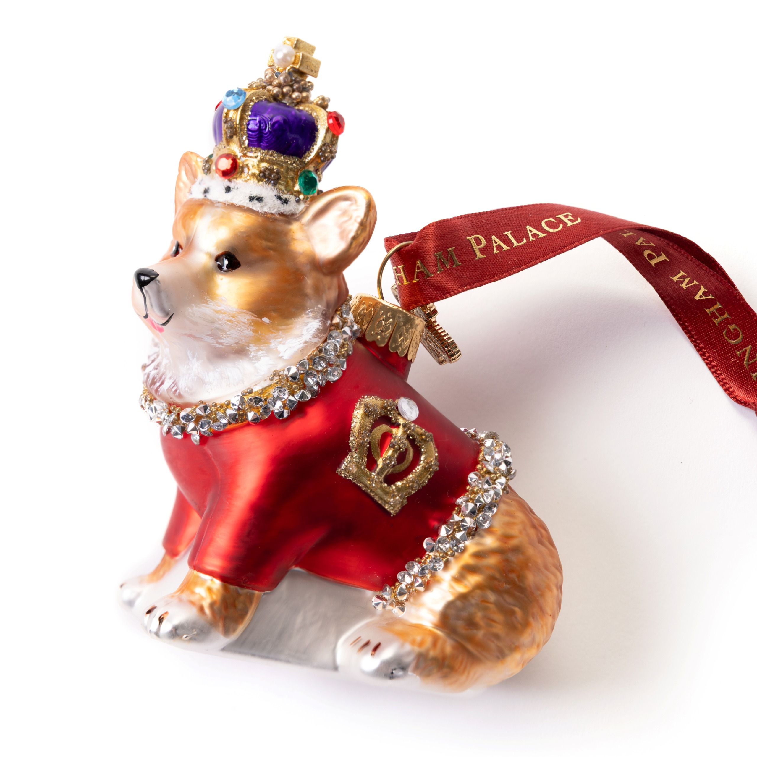 A corgi christmas ornament wearing a crown