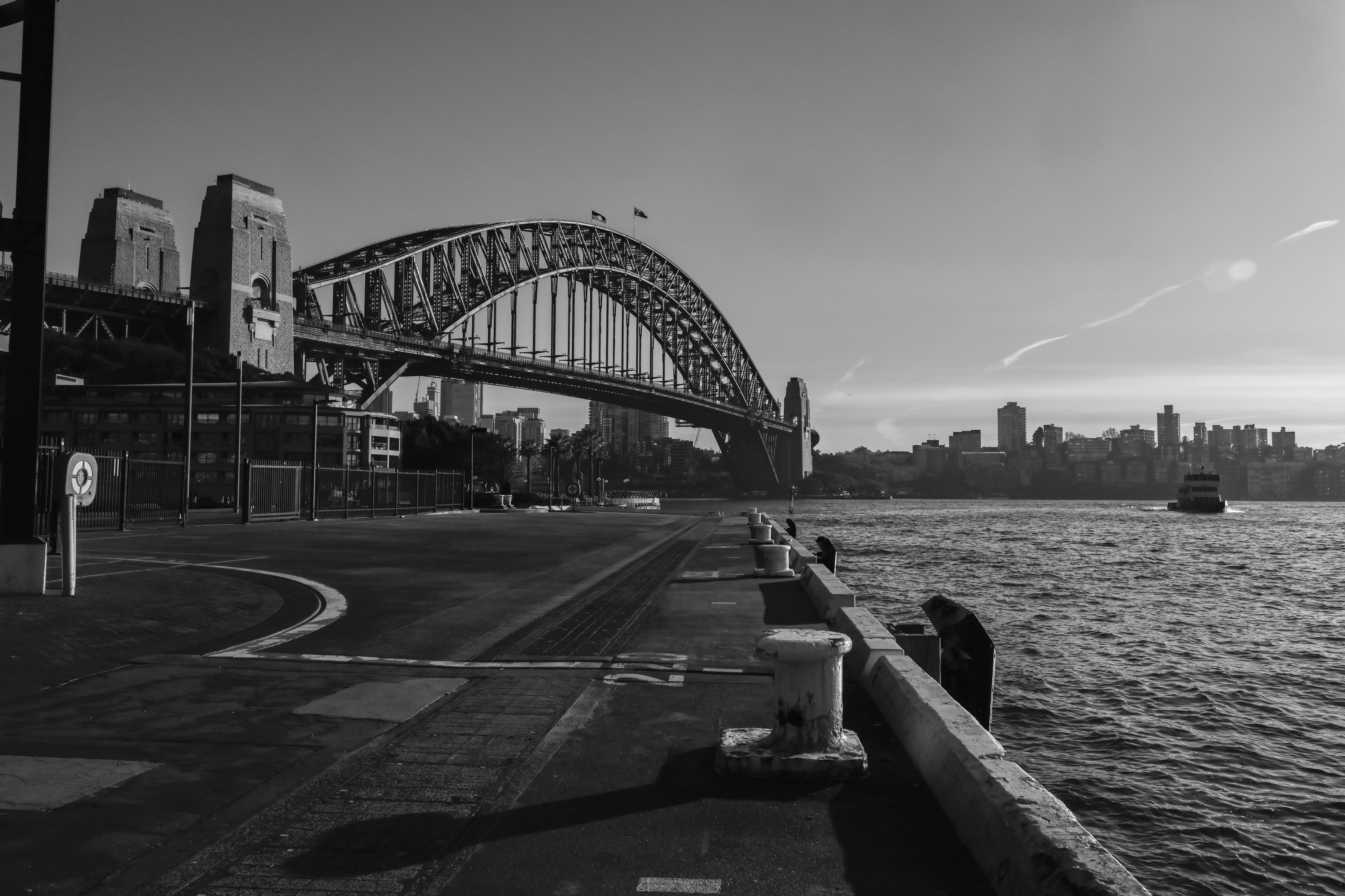 A black-and-white photo of the Sydney Harbour Bridge