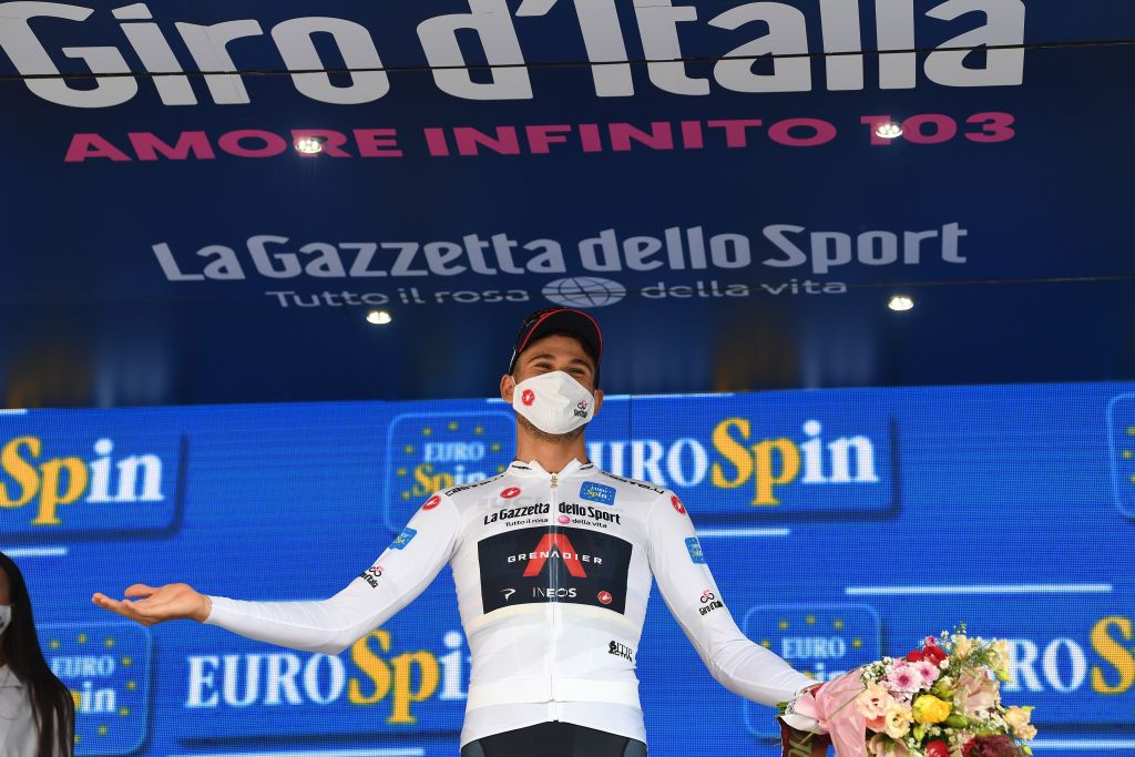 PALERMO ITALY OCTOBER 03 Podium Filippo Ganna of Italy and Team INEOS Grenadiers White Best Young Jersey Celebration Mask Covid safety measures Flowers during the 103rd Giro dItalia 2020 Stage 1 a 151km Individual Time Trial stage from Monreale to Palermo ITT girodiitalia Giro on October 03 2020 in Palermo Italy Photo by Tim de WaeleGetty Images