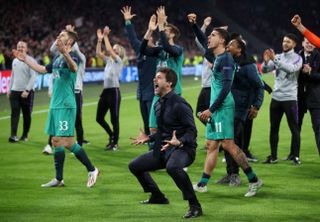 Mauricio Pochettino, front, centre, celebrates taking Tottenham to the Champions League final