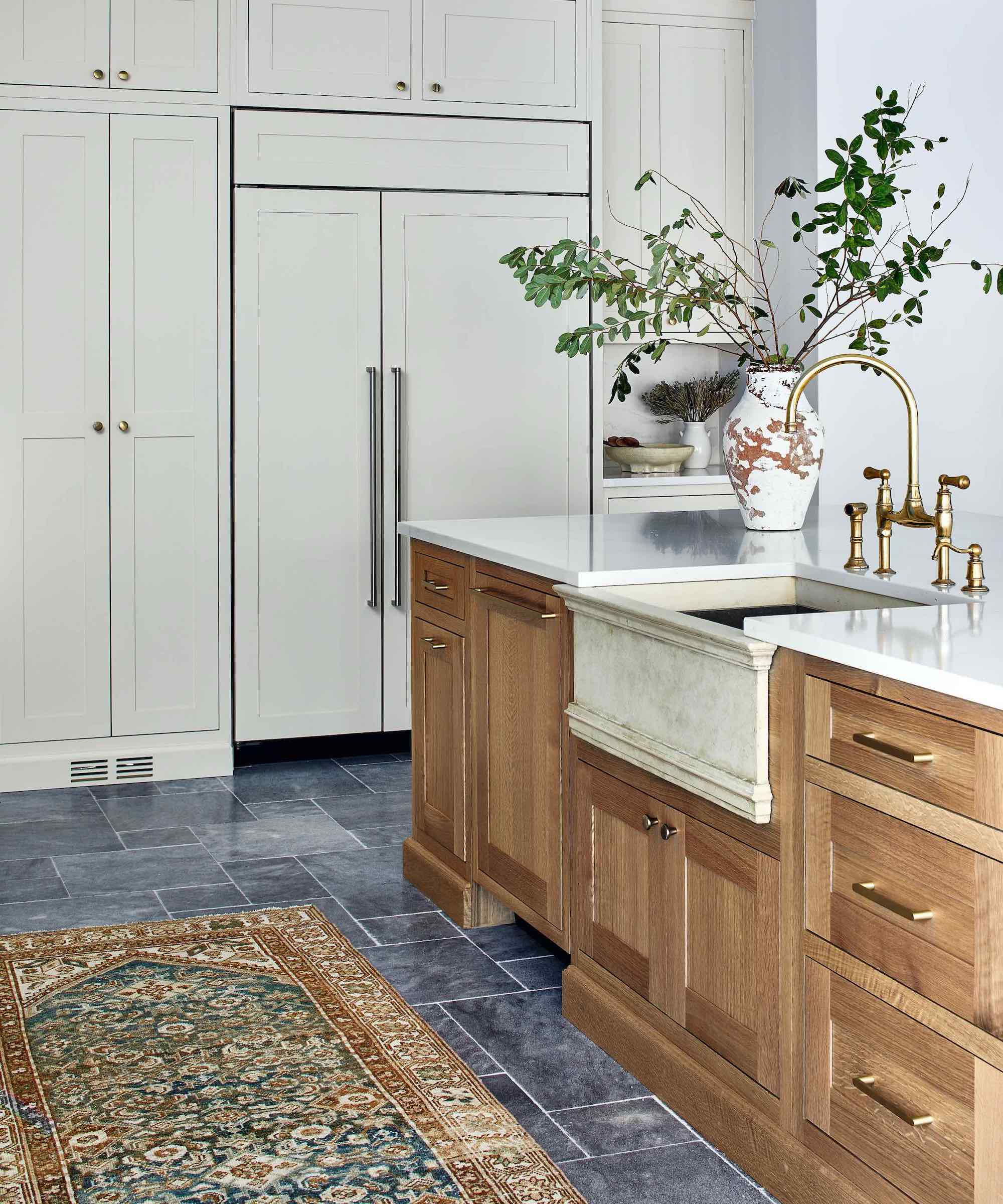 wood and white kitchen with stone sink