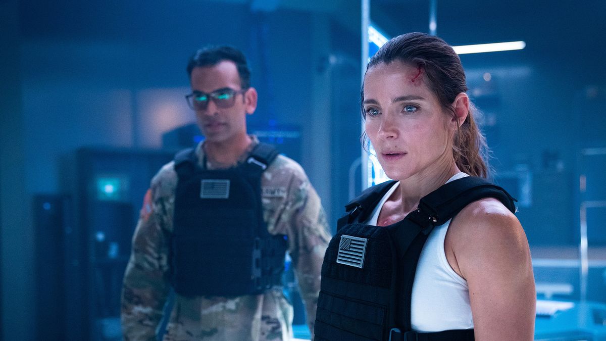 Mayen Mehta as Shah and Elsa Pataky as JJ Collins in INTERCEPTOR