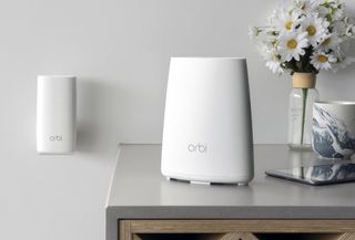 The RBK30 Netgear Orbi system, with small router and plug-in satellite. Credit: Netgear