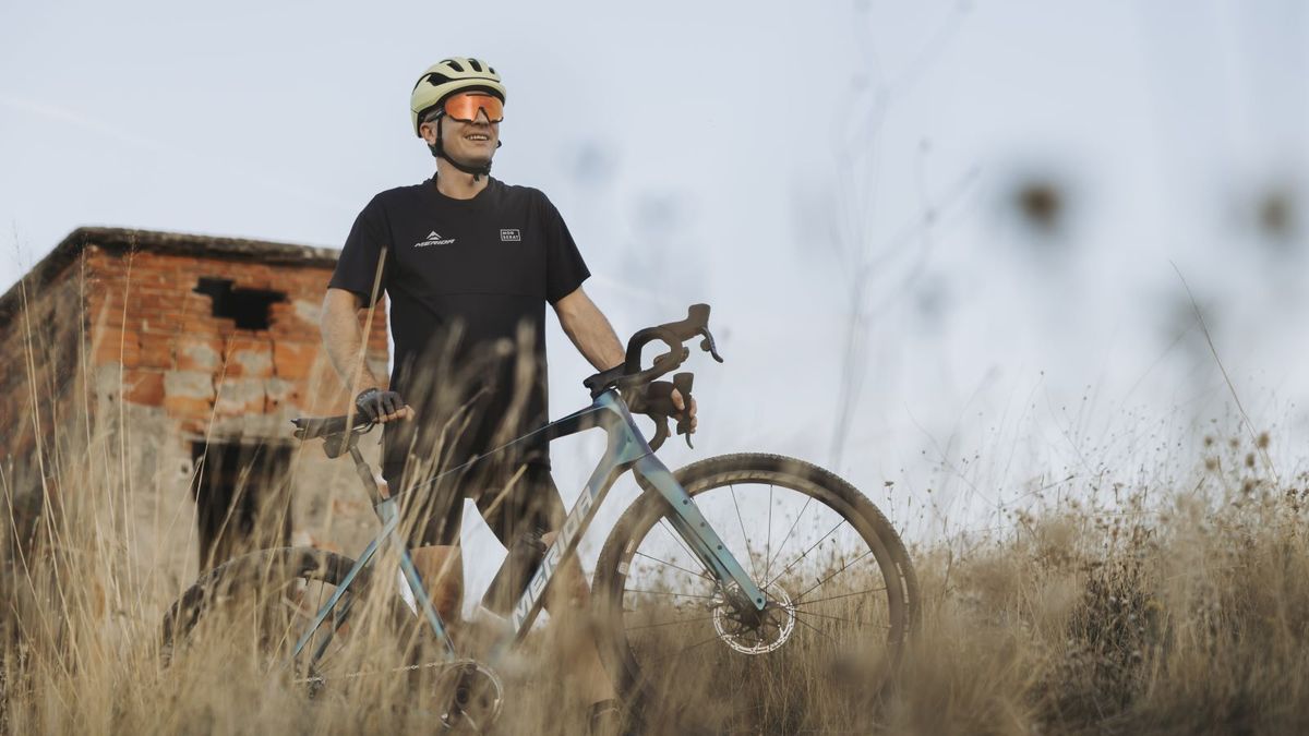 Rider standing next to a Merida Silex gravel bike