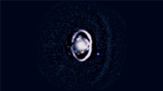 WISPIT 2b appears as a small purple dot beside a bright white dust ring encircling its star, with a fainter outer ring visible beyond it in new observations from the Magellan and Large Binocular Telescopes.