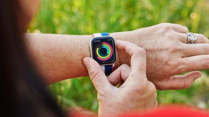 A person looks at their activity progress on their Apple Watch.