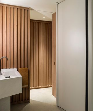 Wooden cladding within a bathroom design by Fran Hickman
