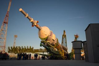 The Soyuz rocket is ready to be erected into position after being rolled out to the launch pad by train, on Sunday, October 21, 2012, at the Baikonur Cosmodrome in Kazakhstan. Launch of the Soyuz rocket is scheduled for October 23 and will send Expedition 33/34 Flight Engineer Kevin Ford of NASA, Soyuz Commander Oleg Novitskiy and Flight Engineer Evgeny Tarelkin of ROSCOSMOS on a five-month mission aboard the International Space Station.