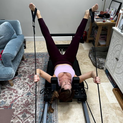 Anna trying at an home Reformer Pilates machine 