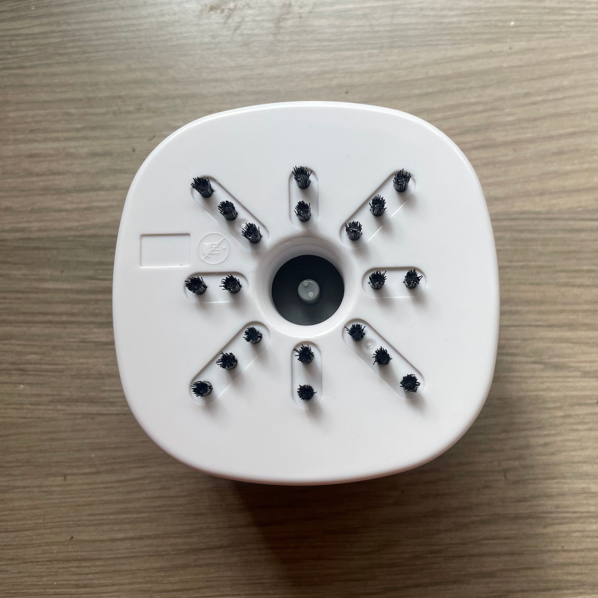 Underside of the Lakeland mini countertop vacuum, showing the bristles