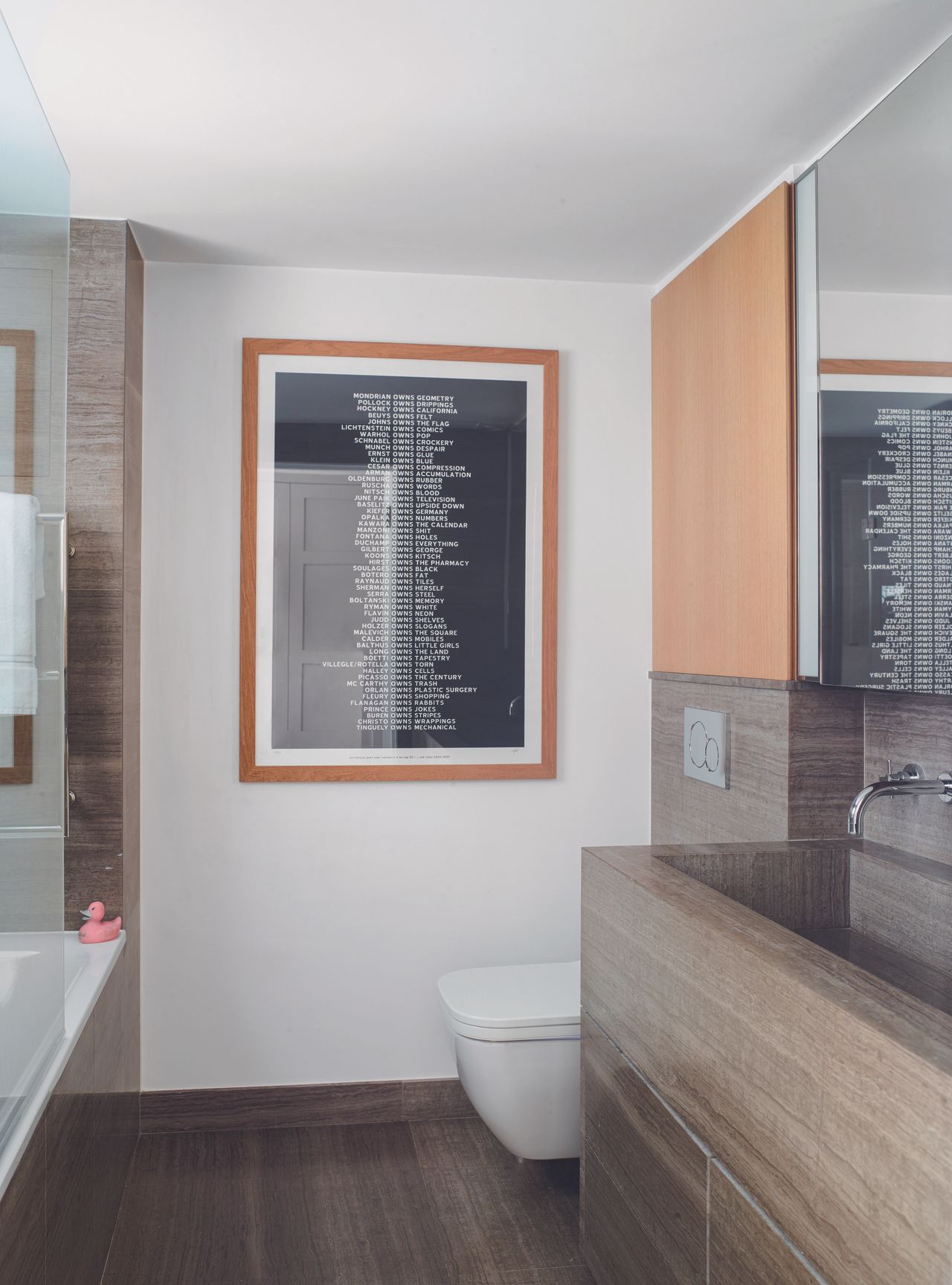 The bathroom with a focal piece of monochrome art