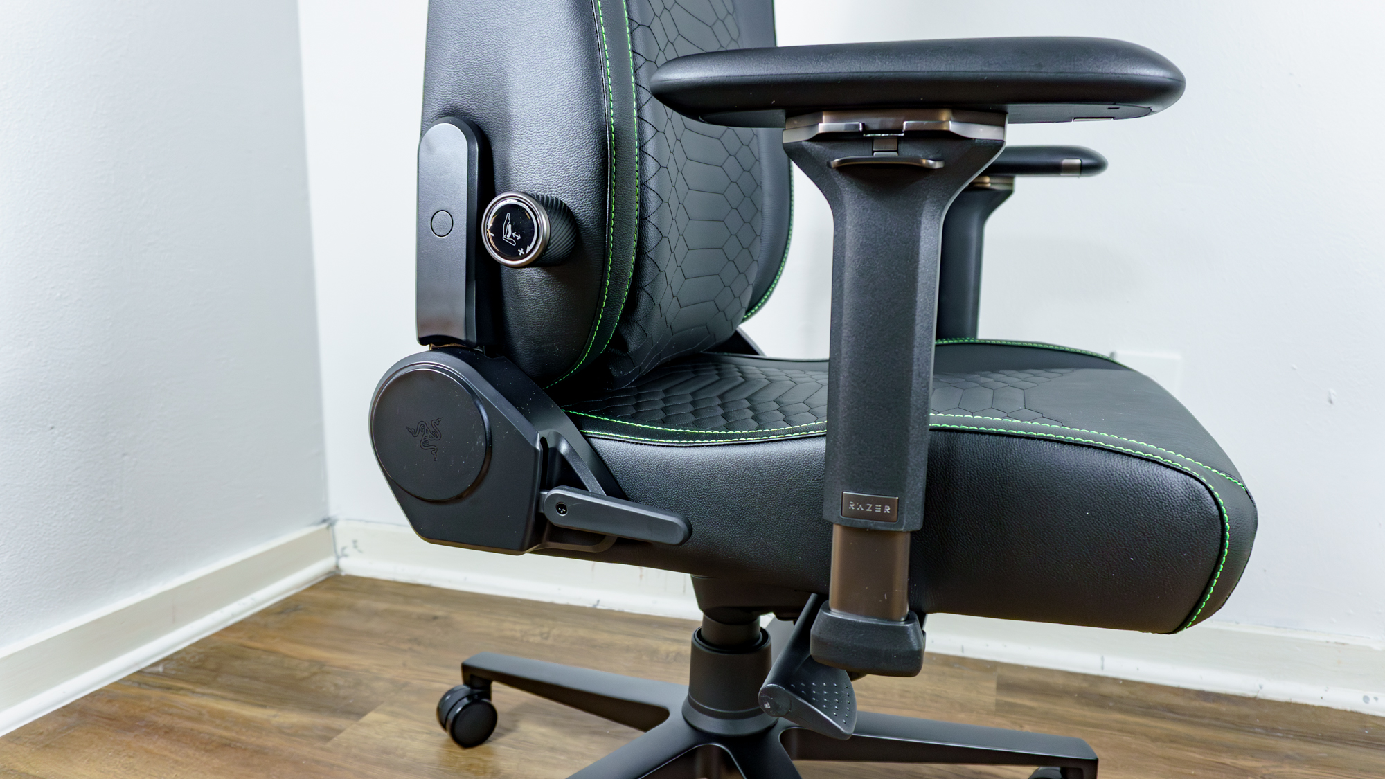 A close-up shot of the lever and adjustment knobs on the right side of the Razer Iskur V2 NewGen gaming chair