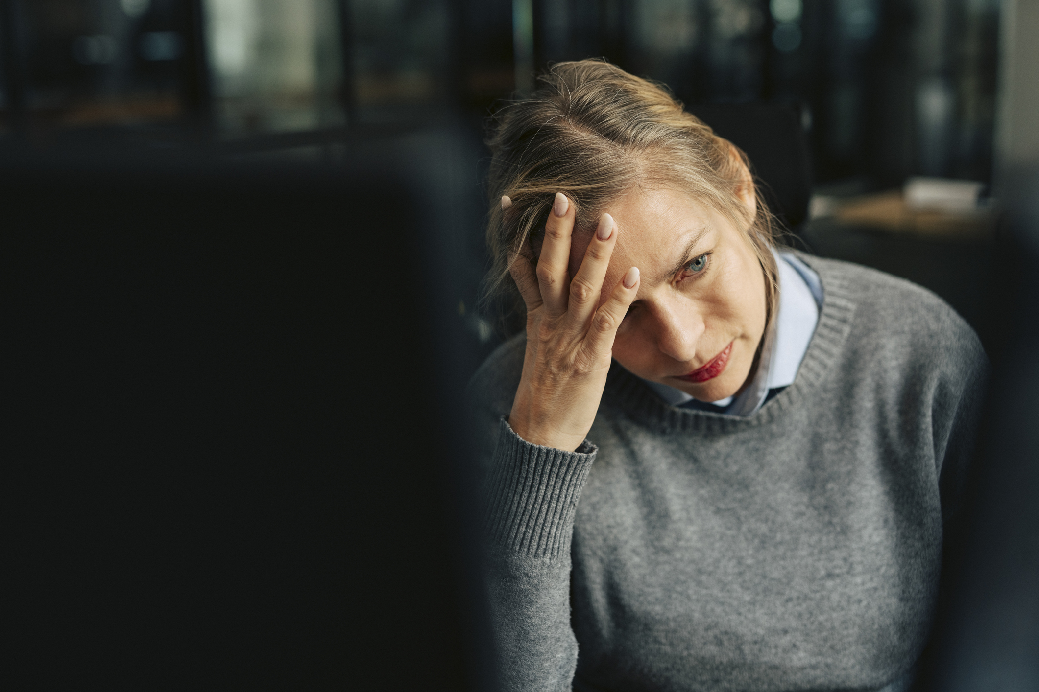 A female worker looking worried about redundancy