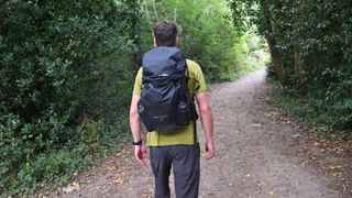 Man wearing Berghaus Remote Hike 35 on the trail