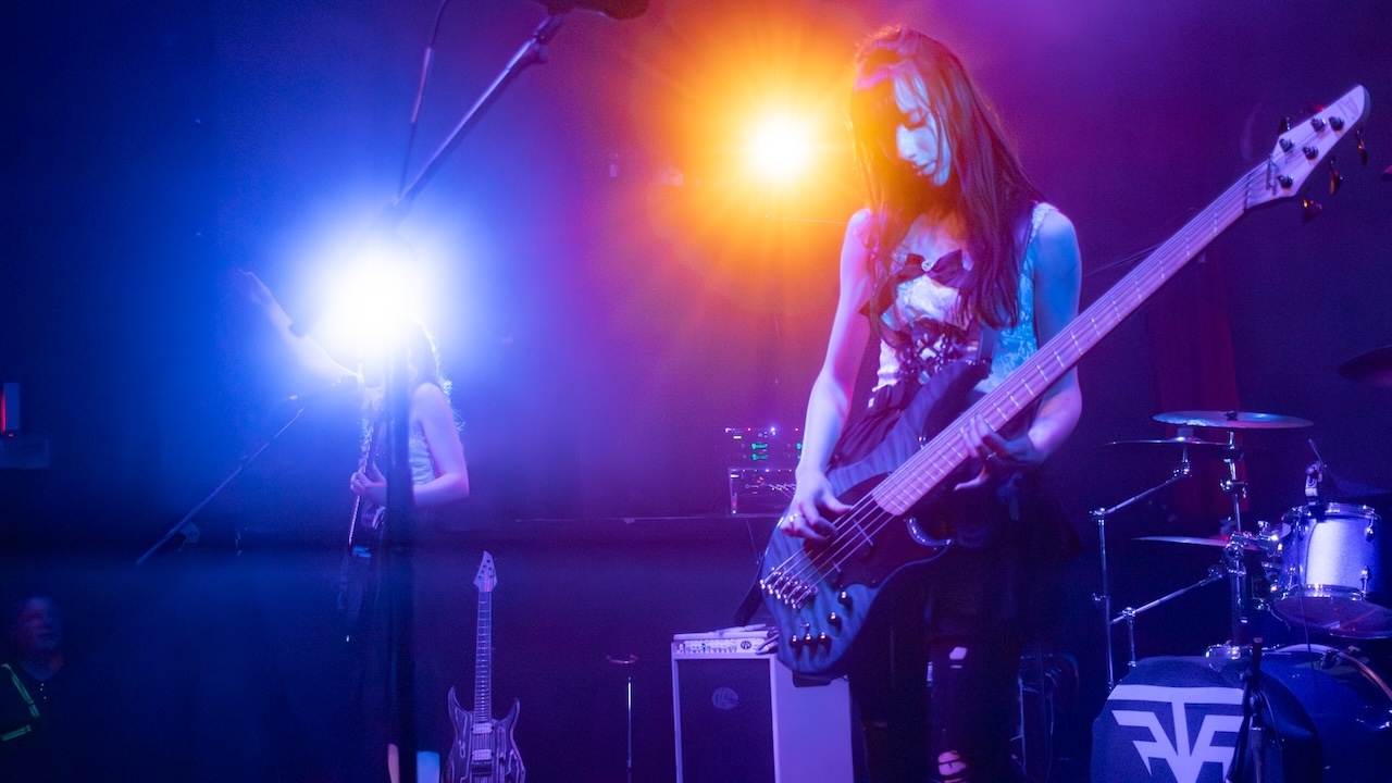 Aria Becker onstage with Freeze the Fall