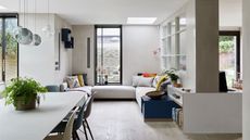 Worst trends. Open plan dining, living area in neutral colours with a pale wooden floor and windows looking out onto the garden.