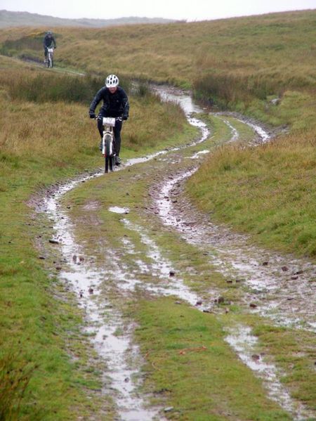 A rider on a wet doubletrack during day six of the TransWales