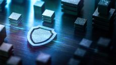 Cybersecurity concept image showing a digitized shield sign surrounded by data blocks.