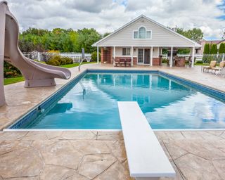 pool with slide and diving board