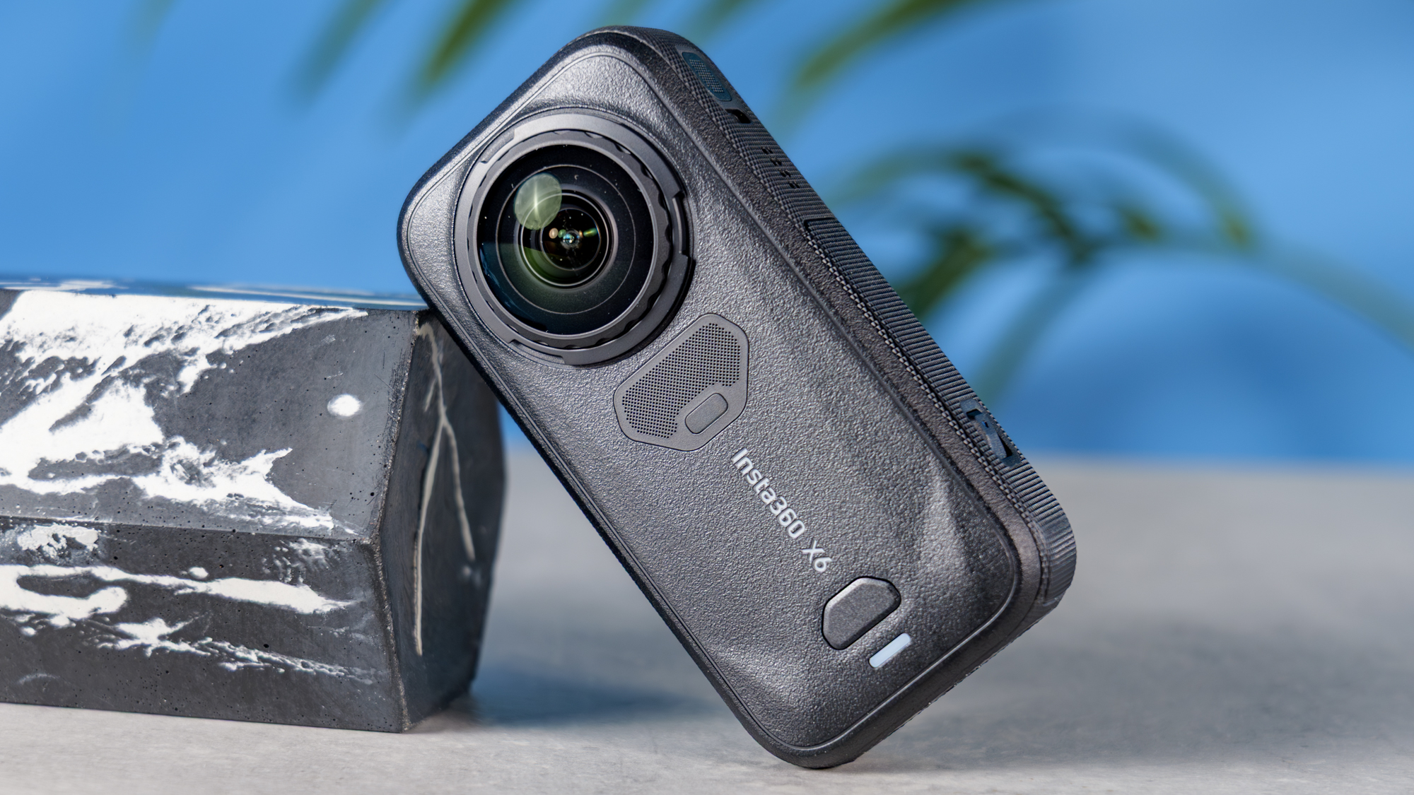 A photo of the Insta360 X6 on a stone surface, resting on a marble plinth