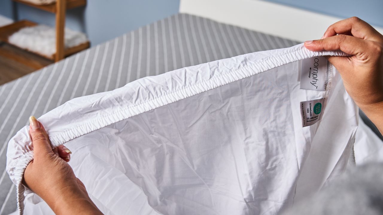 Fitted sheet elastic stretched up-close as part of Coop Percale sheet set testing