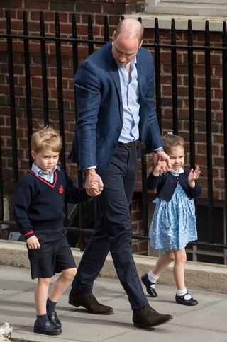 Prince William, Duke of Cambridge arrives with Prince George and Princess Charlotte at the Lindo Wing