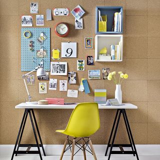 office cork board wall with table and chair