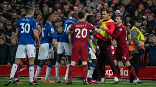 Players of Liverpool and Everton confront each other during the Premier League match between Liverpool and Everton at Anfield on 13 February, 2023 in Liverpool, United Kingdom.