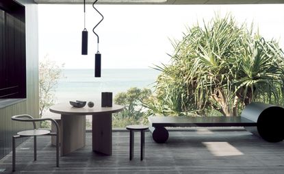 Coffee table, and abstract seating and lighting with sea view