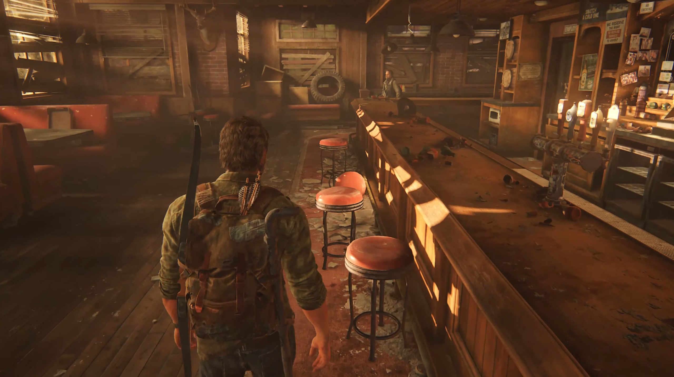 Joel in a bar in The Last of Us Part 1