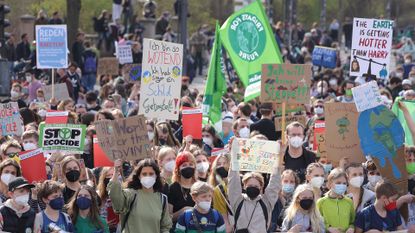 Supporters of the Fridays for Future climate action movement march as part of a global climate strike on March 25 in Berlin, Germany. The movement is calling particular attention to the current Russian war in Ukraine, warning that the war is distracting world leaders from achieving climate goals and highlights the need for a faster global reduction in fossil fuel dependence.