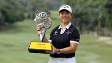 Ruoning Yin holds up the 2024 Maybank Championship trophy