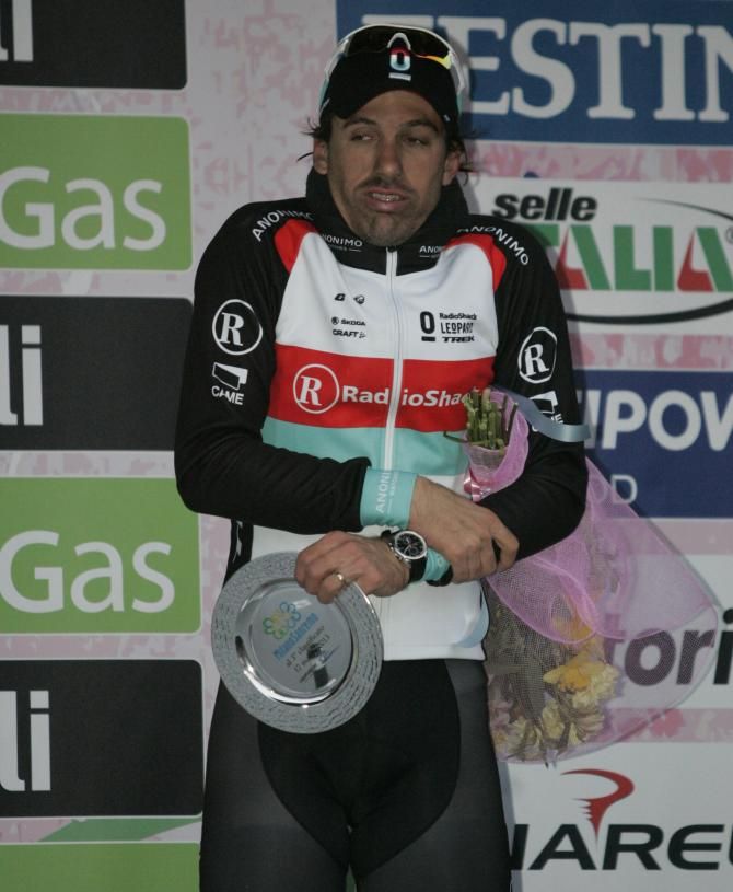 Fabian Cancellara tries to get himself warm on the Milano-Sanremo podium