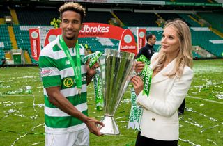 Scott Sinclair and Helen Flanagan hold the Scottish Premiership trophy after Celtic's 2016/17 title win